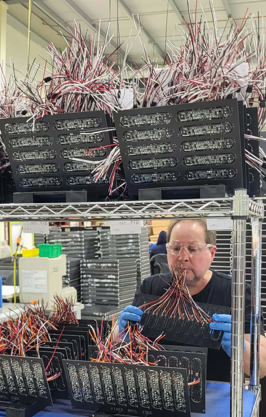 image of Whelen employee in lighting manufacturing plant