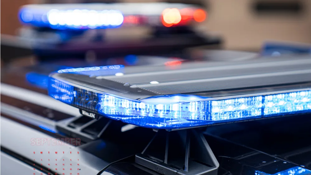 close-up image police emergency vehicle with blue Whelen lightbar