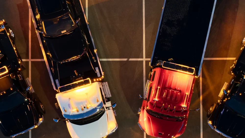downloadable wallpaper image showing towing vehicles parked in parking lot
