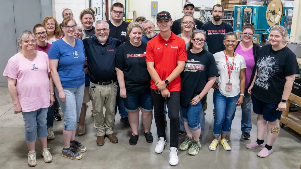 A group from Building Three poses with Jesse and Danny.
