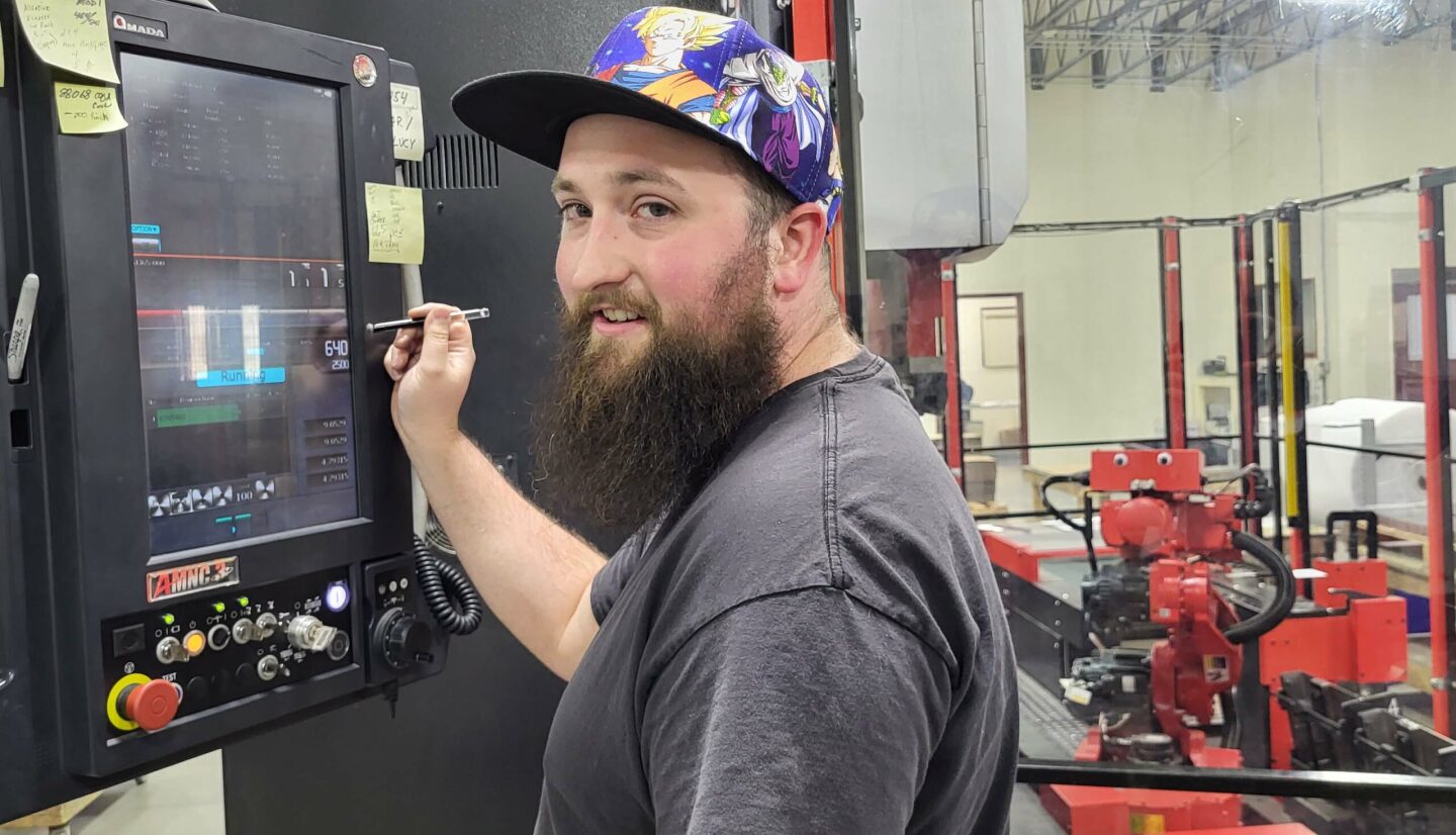 Whelen engineer testing components in a Whelen manufacturing facility