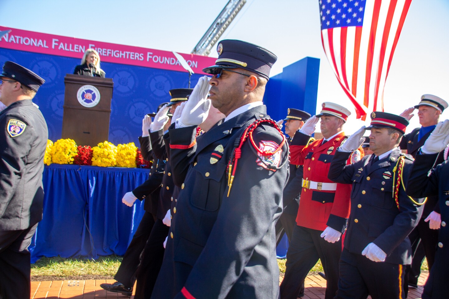 image of saluting officers during parade for National Fallen Firefighters Foundation
