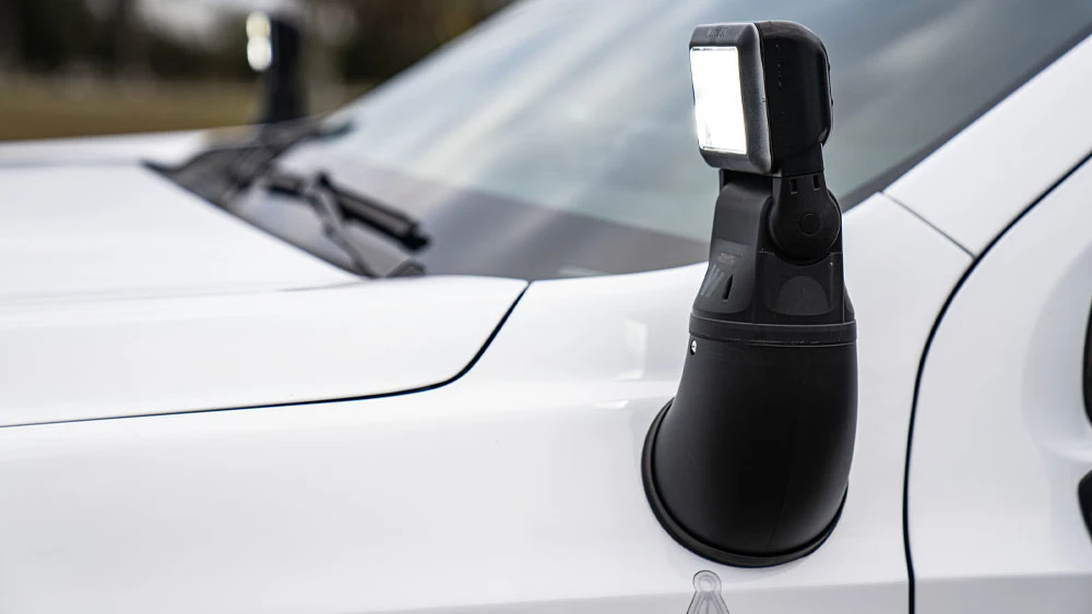 image of Whelen Arges remote spotlight installed on side of emergency vehicle
