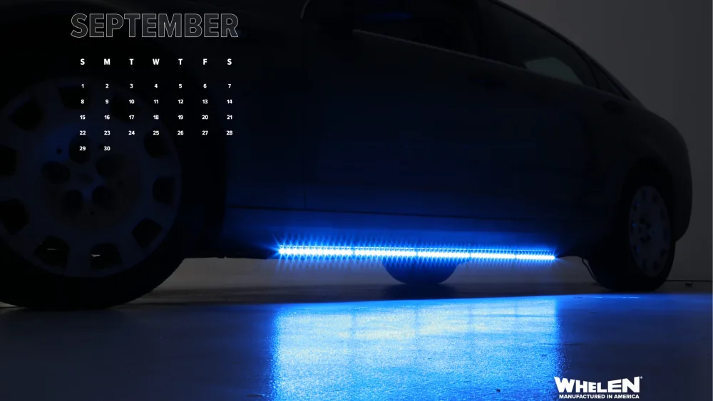 wallpaper calendar image of emergency vehicle with blue Wheln light array
