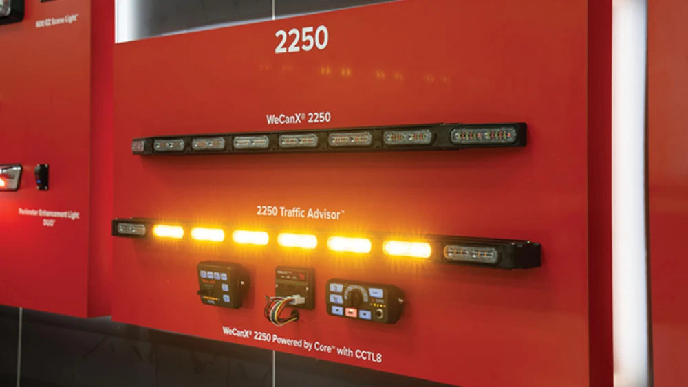 showroom exhibit showing amber Whelen 2250 Series lightbar on display at trade show