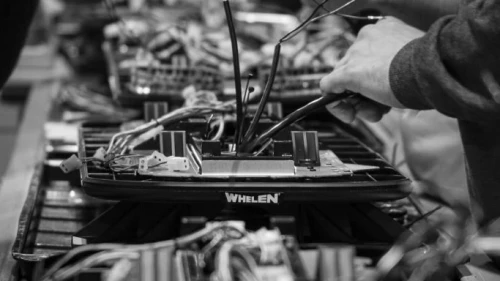 image of Whelen Engineering employee working on Whelen product in manufacturing facility