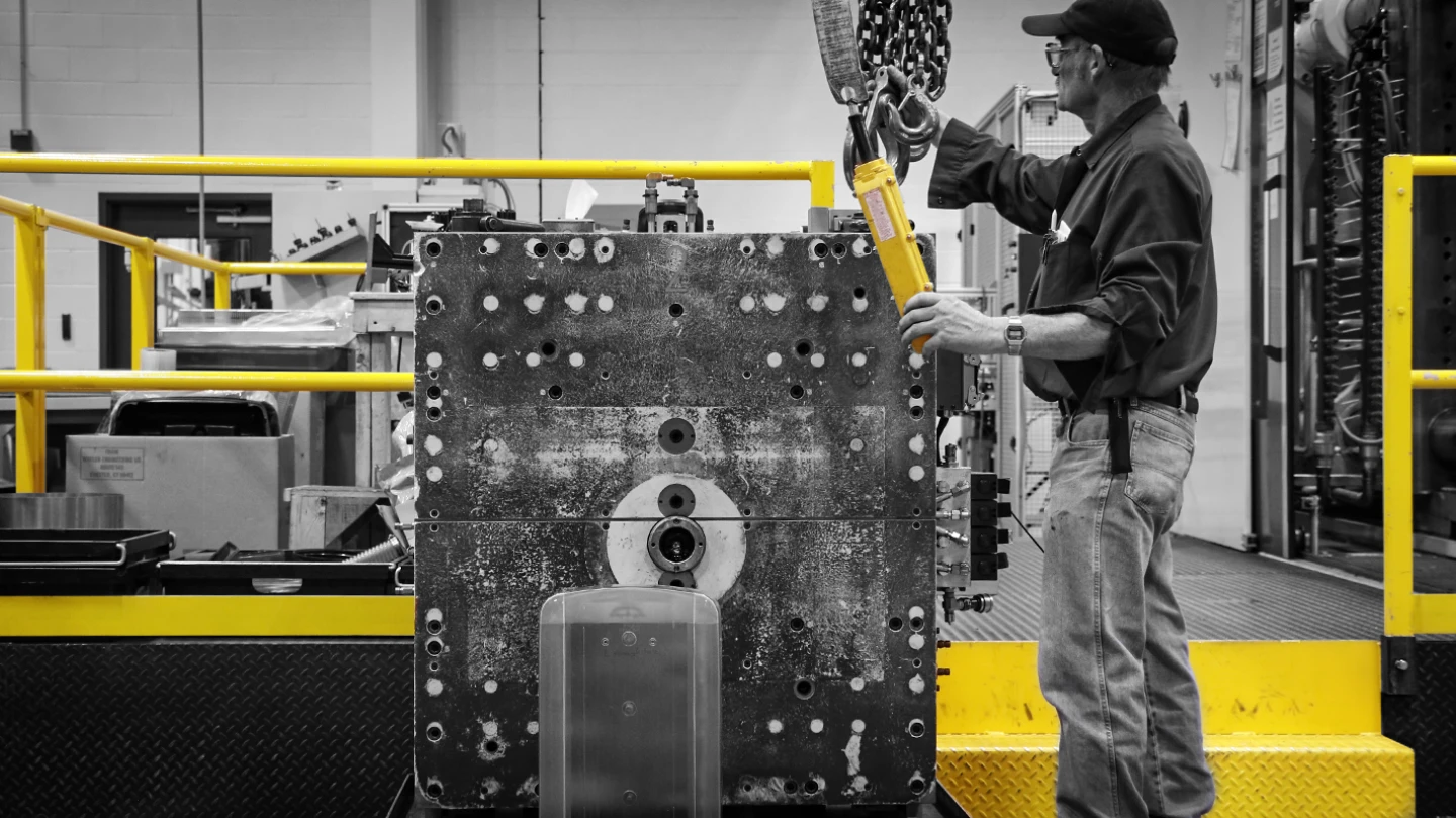 image of Whelen Engineering employee operating machinery in Whelen manufacturing facility for emergency lighting