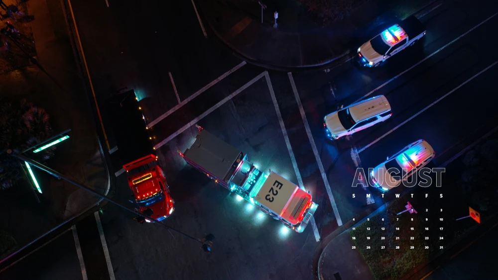 downloadable wallpaper calendar showing emergency vehicles at scene of nighttime traffic incident