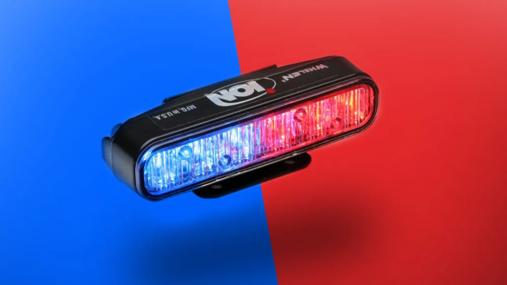 image of Whelen ION Series lighthead on blue and red background